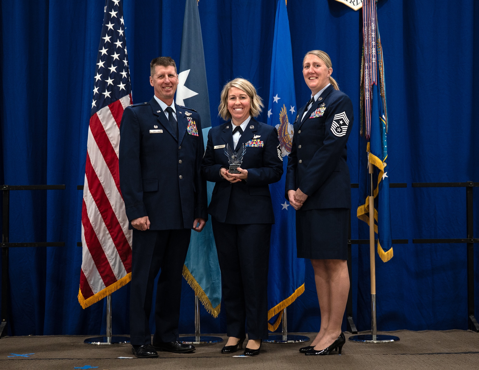 U.S. Air Force Master Sgt. Elizabeth Mahmood, 133rd Maintenance Group, accepts the Outstanding Airman of the Year award for the first sergeant category in St. Paul, Minn., Dec. 6, 2025.