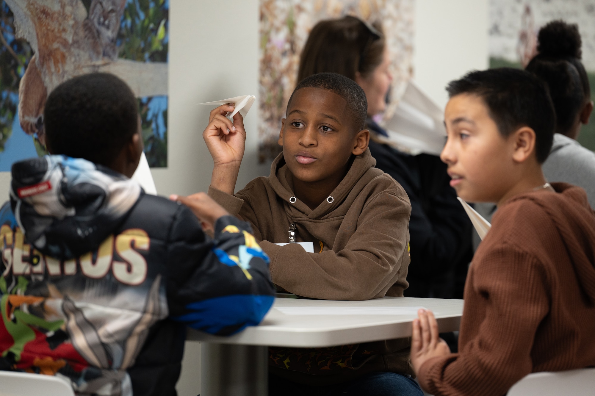 STARBASE Edwards students from East Side Elementary in Lancaster, Calif., compare and discuss their paper airplanes