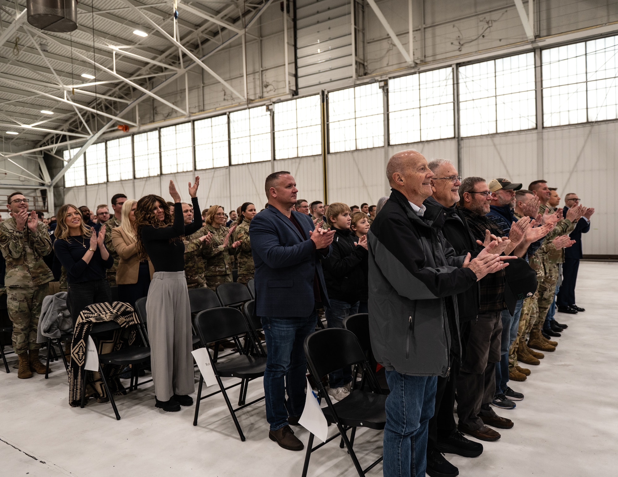 U.S. Air Force Airmen from the 133rd Airlift Wing, along with family and friends attend the assumption of responsibility ceremony for the 16th Command Chief Master Sgt., in St. Paul, Minn., Dec. 6, 2025.