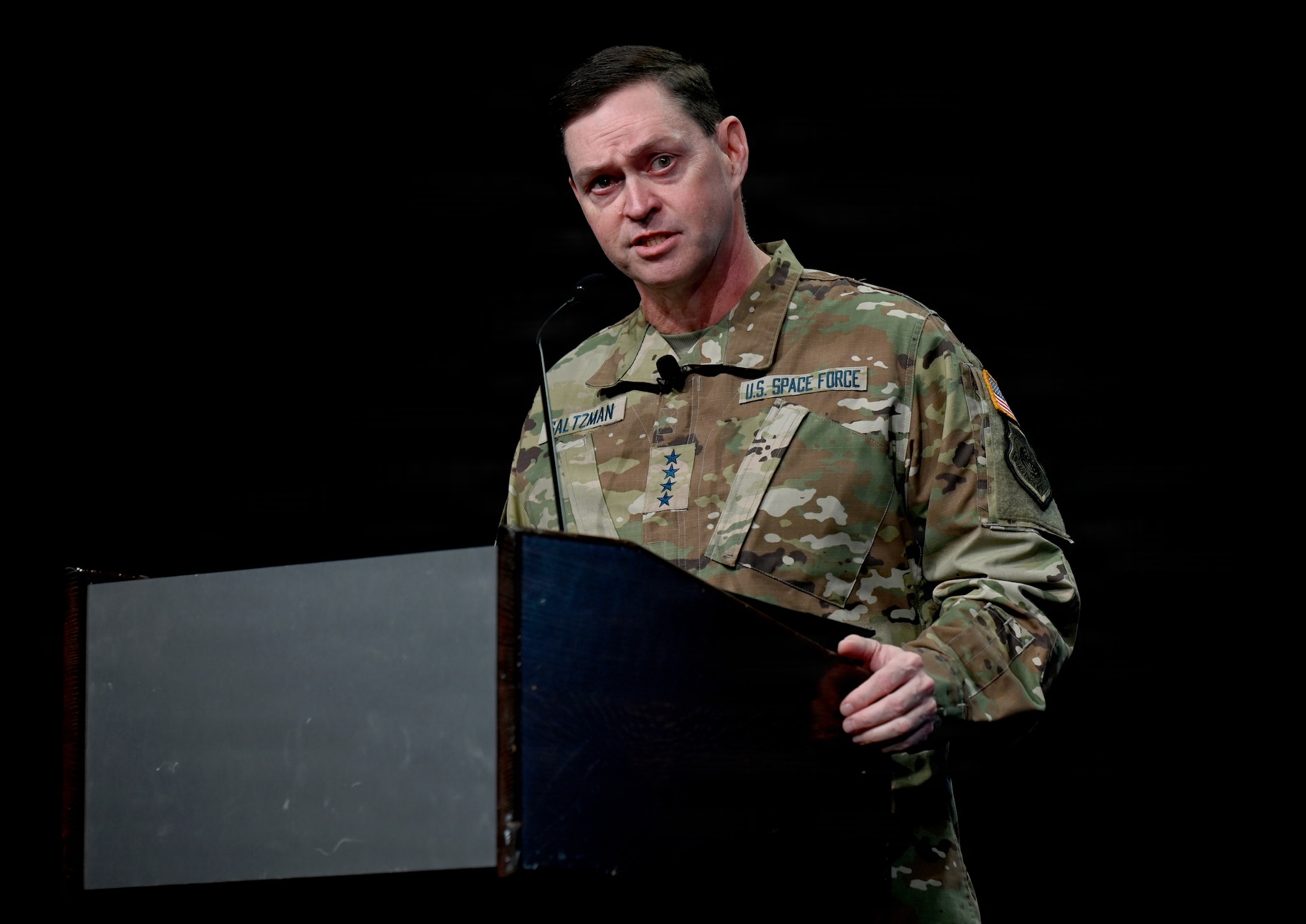 Gen Chance Saltzman delivers a speech behind a podium