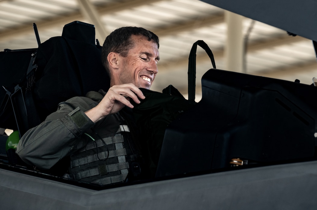 U.S. Air Force Brig. Gen. David Epperson, USAF Warfare Center commander, checks his gear in the cockpit of an F-35A Lightning II