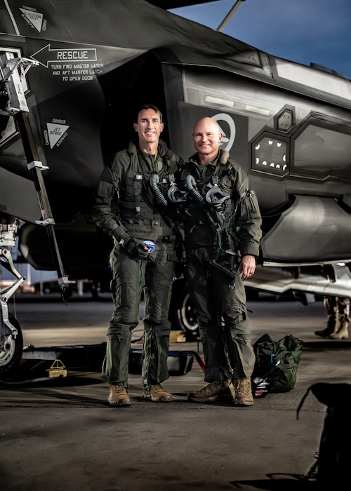 U.S. Air Force Brig. Gen. David Epperson (left), USAF Warfare Center commander, and Brig. Gen. David Berkland, 56th Fighter Wing commander, pose for a photo