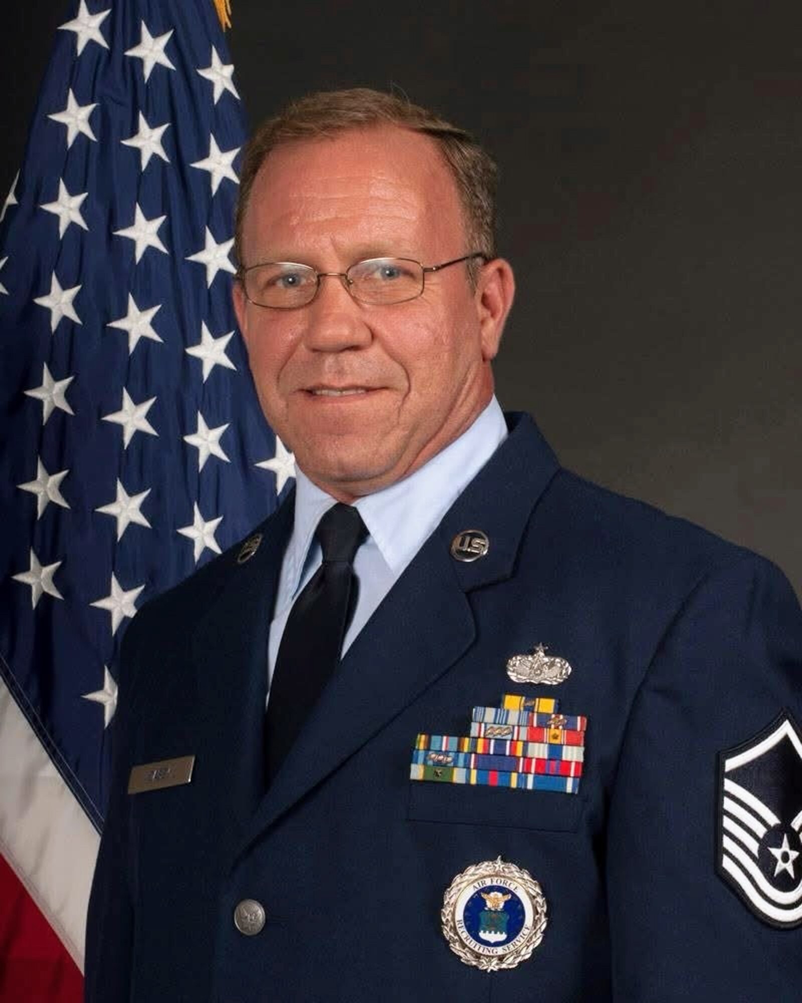 Then Master Sgt. Thomas Casey stands for an official photo in December 2012. Casey started his Air Force career in 1991 as a pavements and construction specialist and retired in 2012 as a military entrance processing station liaison in Minnesota before returning to active duty through the Voluntary Retired Return to Active Duty program in 2025. (courtesy photo)
