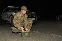U.S. Air Force Senior Airman Ace Fry, 9th Civil Engineer Squadron (CES) Explosive Ordnance Disposal (EOD) technician, prepares a container to move an Unexploded Ordnance (UXO) in Gualala, California, Dec. 9, 2025.