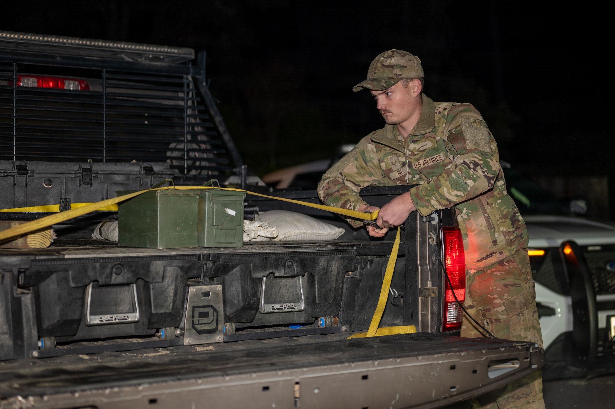 U.S. Air Force Senior Airman Ace Fry, 9th Civil Engineer Squadron (CES) Explosive Ordnance Disposal (EOD) technician, secures a container to move an Unexploded Ordnance (UXO) in Gualala, California, Dec. 9, 2025.
