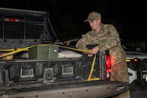 U.S. Air Force Senior Airman Ace Fry, 9th Civil Engineer Squadron (CES) Explosive Ordnance Disposal (EOD) technician, secures a container to move an Unexploded Ordnance (UXO) in Gualala, California, Dec. 9, 2025.