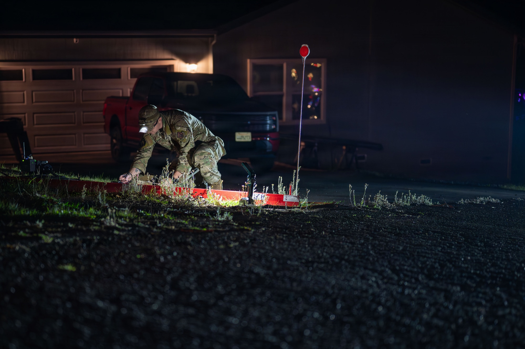 U.S. Air Force Staff Sgt. Bryce Schott, 9th Civil Engineer Squadron (CES) Explosive Ordnance Disposal (EOD) operations non-commissioned officer in charge, assesses an Unexploded Ordnance (UXO) in Gualala, California, Dec. 9, 2025.