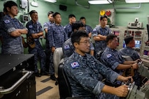 Crew members assigned to the Republic of Korea (ROK) Submarine Ahn Mu (SS 085) participate in a submarine training evolution during a visit to Naval Submarine Training Center Pacific (NSTCP) Detachment Guam, Dec. 1, 2025.