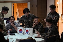 Republic of Korea Air Force officers collaborate during the U.S. Forces Korea Information Operations Wargame, working through scenario-driven challenges designed to sharpen regional strategy and strengthen combined understanding of the information environment, Oct 16, 2025.