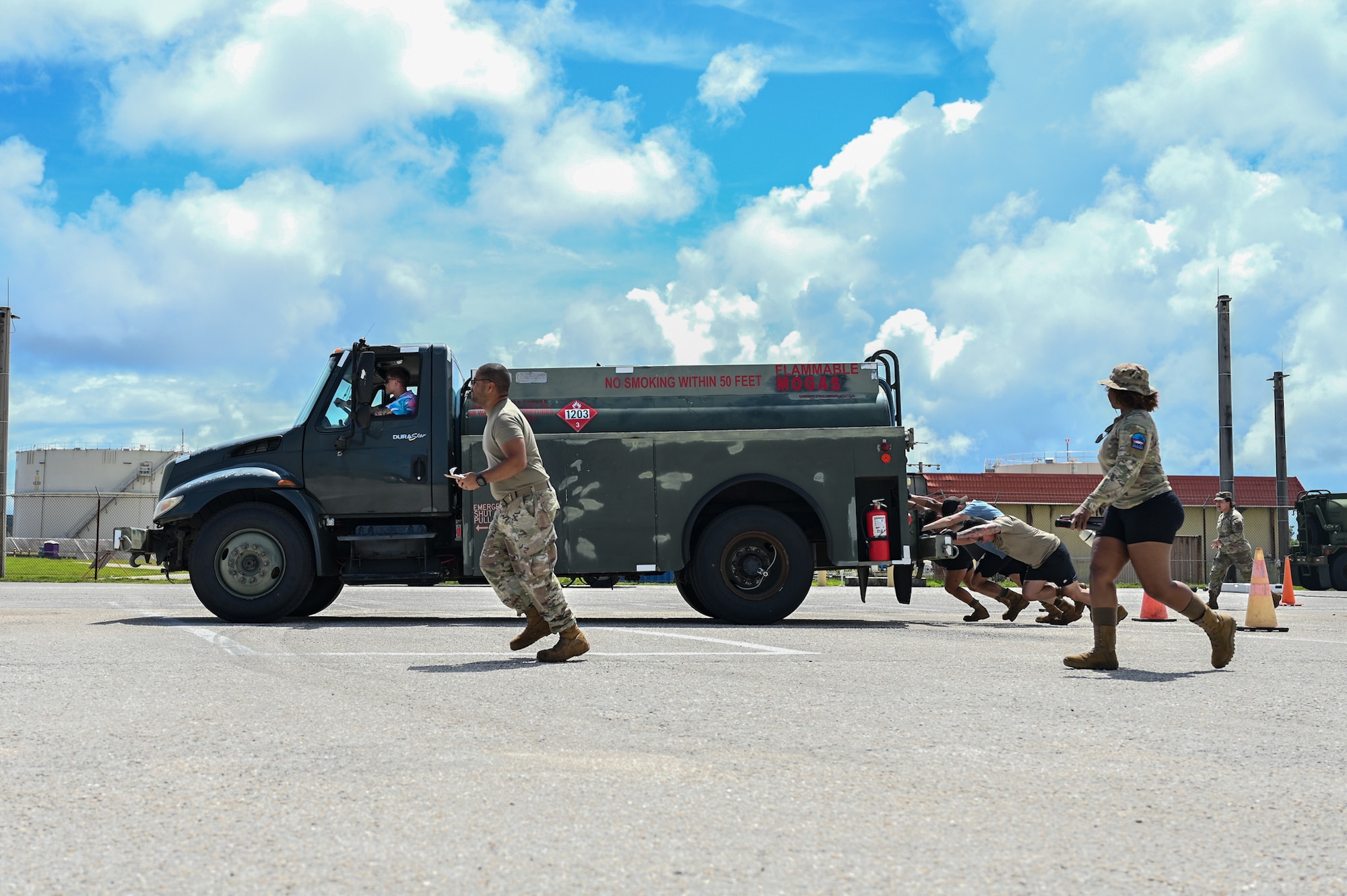 U.S. Air Force Airmen from the 36th Logistics Readiness Squadron push a fuel truck during the last stretch of the fuels rodeo competition at Andersen Air Base, Guam, Oct. 9, 2025.