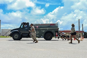 U.S. Air Force Airmen from the 36th Logistics Readiness Squadron push a fuel truck during the last stretch of the fuels rodeo competition at Andersen Air Base, Guam, Oct. 9, 2025.