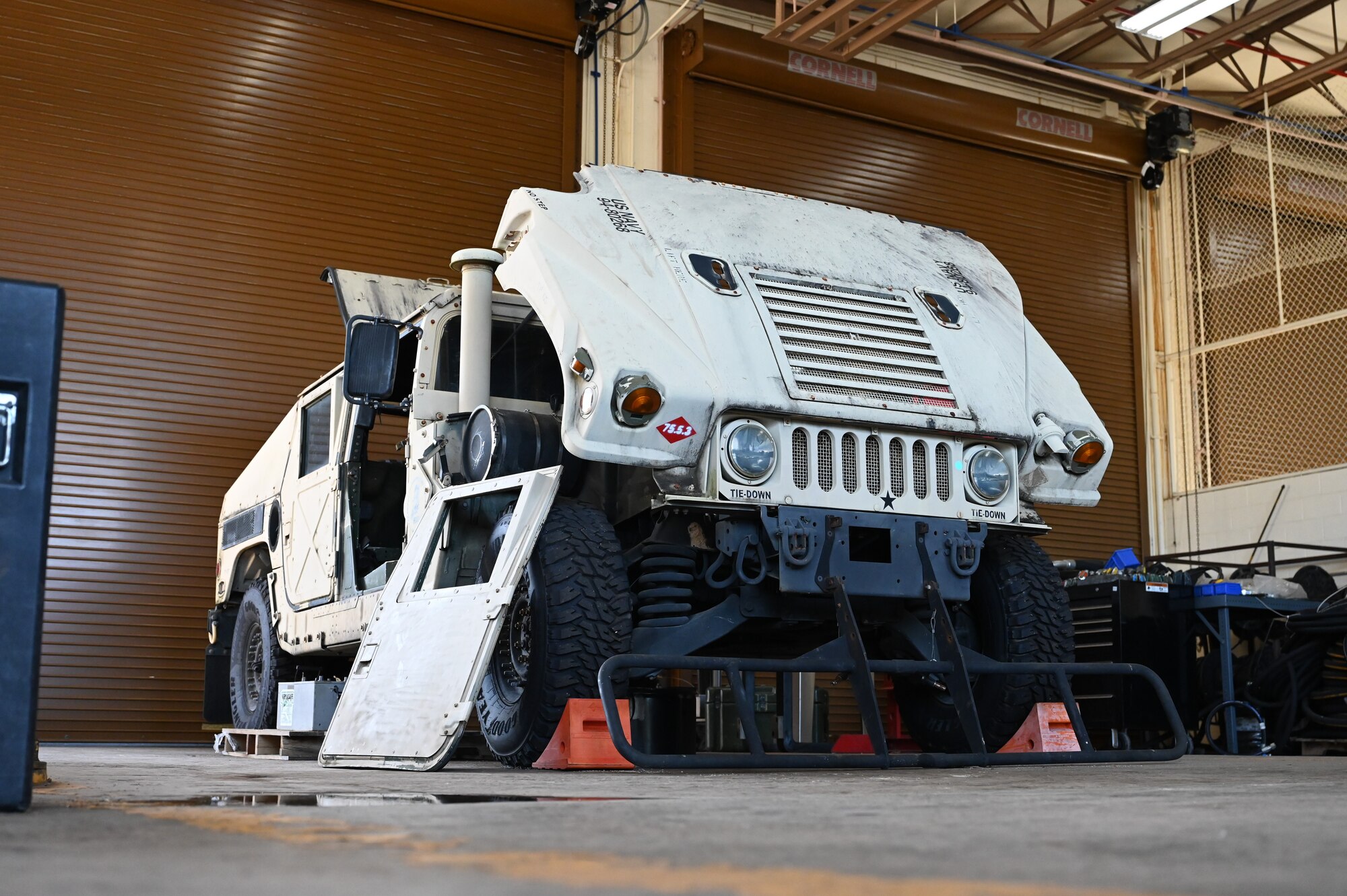 U.S. Air Force Airmen with the 11th Combat Air Base Squadron vehicle maintenance team pose with the Naval Mobile Construction Battalion, also known as the Seabees, after completing projects together at U.S. Naval Base Guam, Dec. 1, 2025.