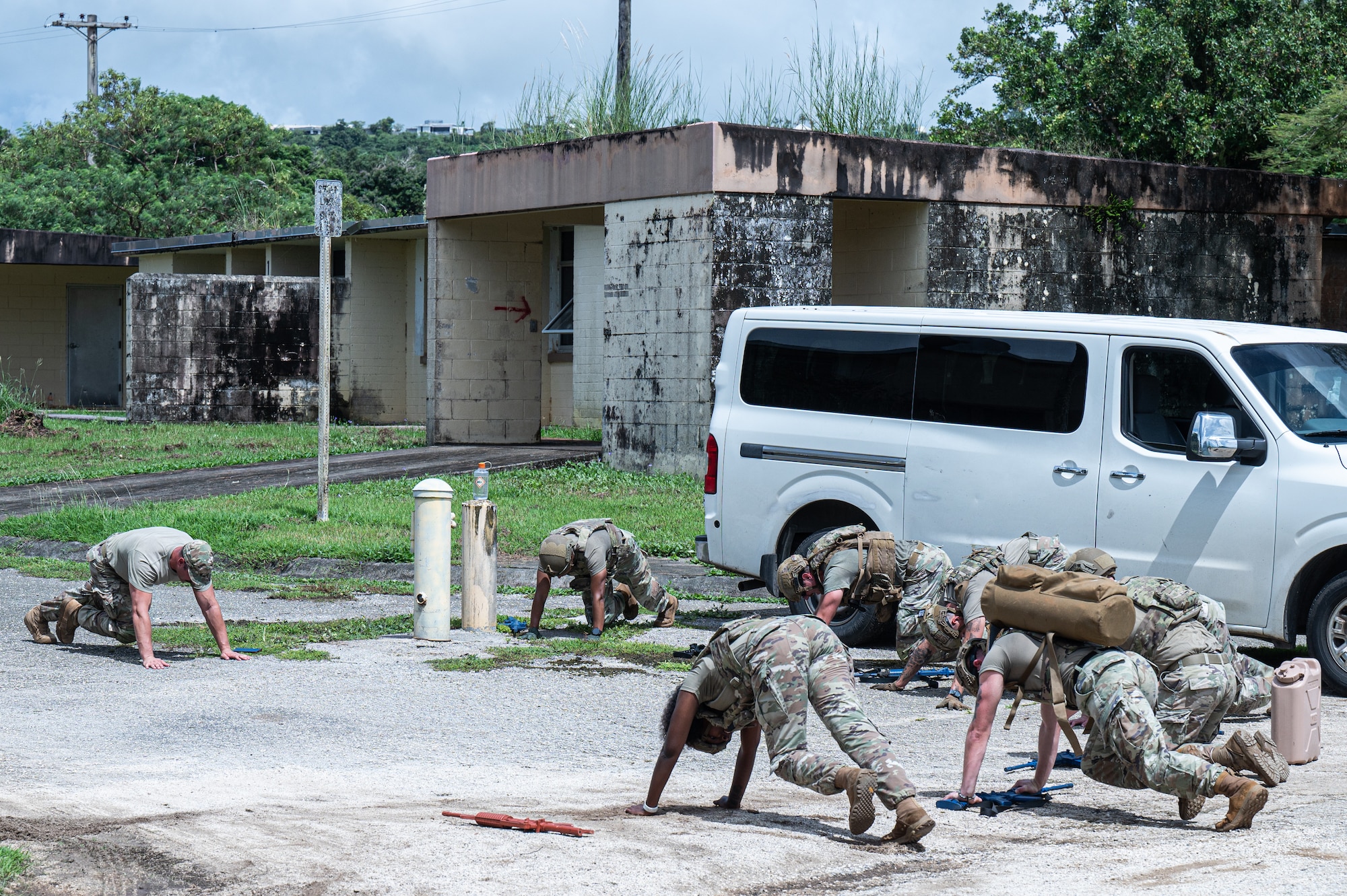 U.S. Air Force Airmen with the 11th Combat Air Base Squadron and 824th Base Defense Squadron practice evacuating a simulated patient during training with Airmen from the 36th Security Forces Squadron at Andersen Air Force Base, Guam, Oct. 21, 2025.