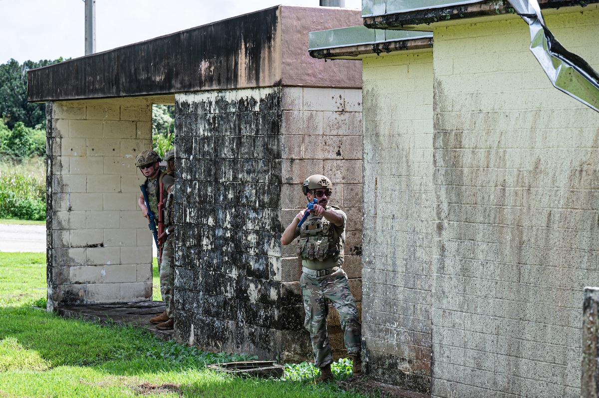 U.S. Air Force Airmen with the 11th Combat Air Base Squadron and 824th Base Defense Squadron practice evacuating a simulated patient during training with Airmen from the 36th Security Forces Squadron at Andersen Air Force Base, Guam, Oct. 21, 2025.