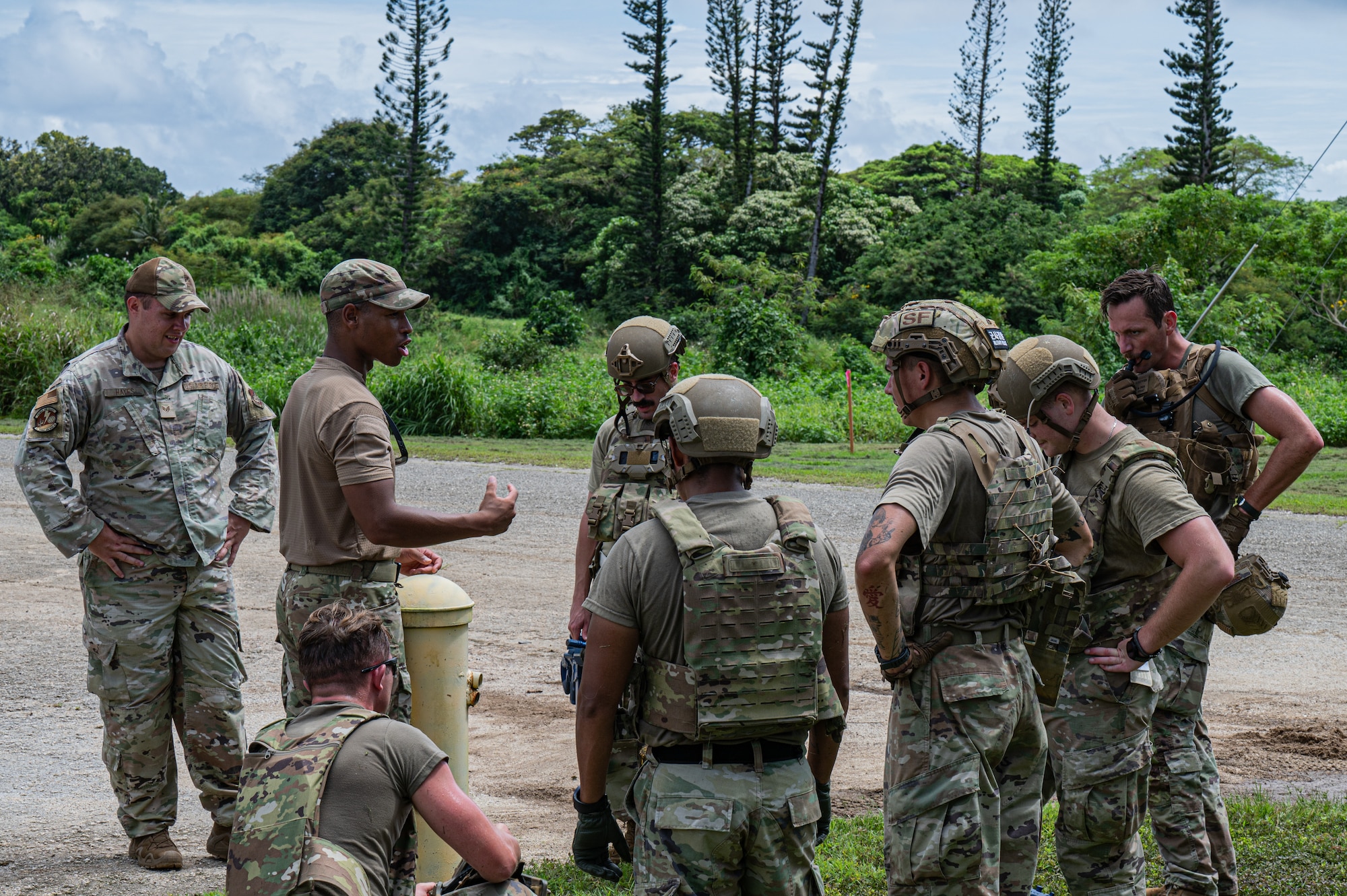 U.S. Air Force Airmen with the 11th Combat Air Base Squadron and 824th Base Defense Squadron practice evacuating a simulated patient during training with Airmen from the 36th Security Forces Squadron at Andersen Air Force Base, Guam, Oct. 21, 2025.