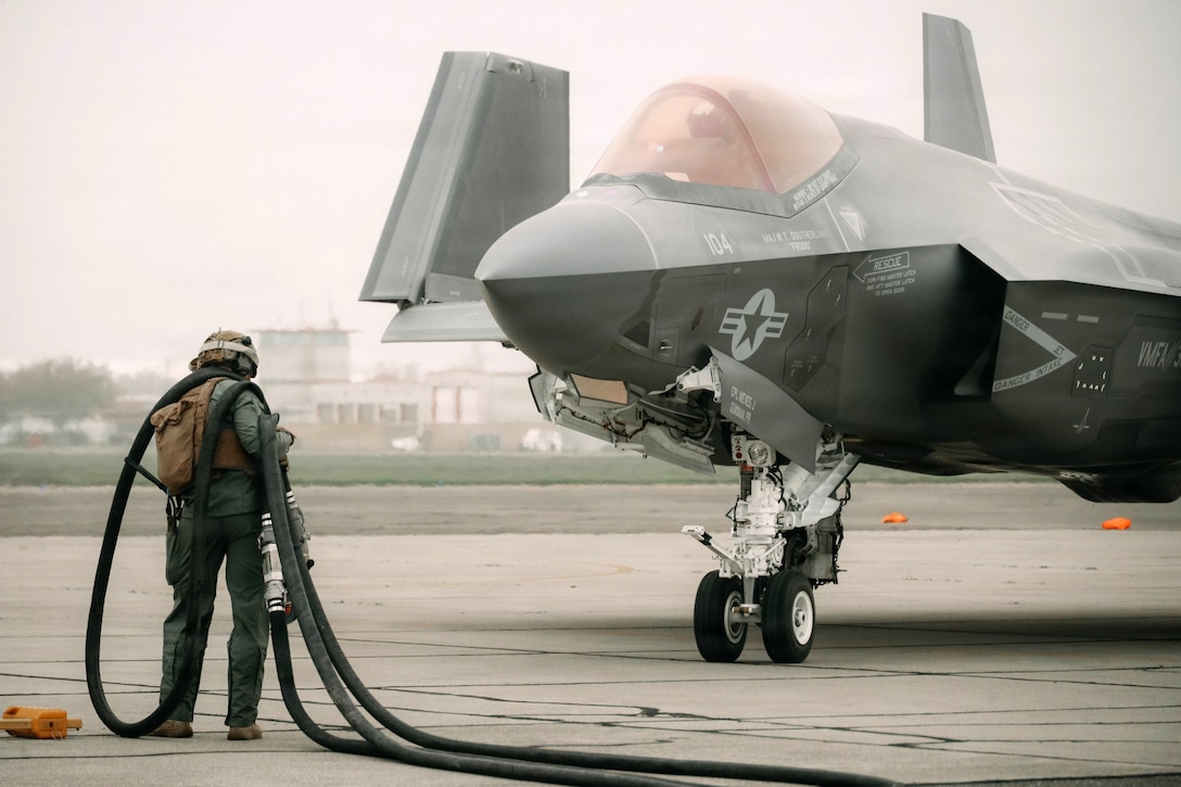 A U.S. Marine with Marine Wing Support Squadron 372, Marine Air Control Group 38, 3rd Marine Aircraft Wing, refuels an F-35B Lightning II assigned to Marine Fighter Attack Squadron (VMFA) 311during exercise Steel Knight 25 at Sacramento Mather Airport, California, Dec. 9, 2025. The forward node at Mather enabled aircraft to arm and refuel before launching a simulated Maritime Strike, demonstrating 3rd MAW’s ability to sustain fixed-wing operations from distributed locations. Steel Knight is an annual exercise that strengthens the Navy-Marine Corps team’s ability to respond forward, integrate across domains, and sustain Marine Air-Ground Task Force readiness. (U.S. Marine Corps photo by Sgt. Brian A. Stippey)