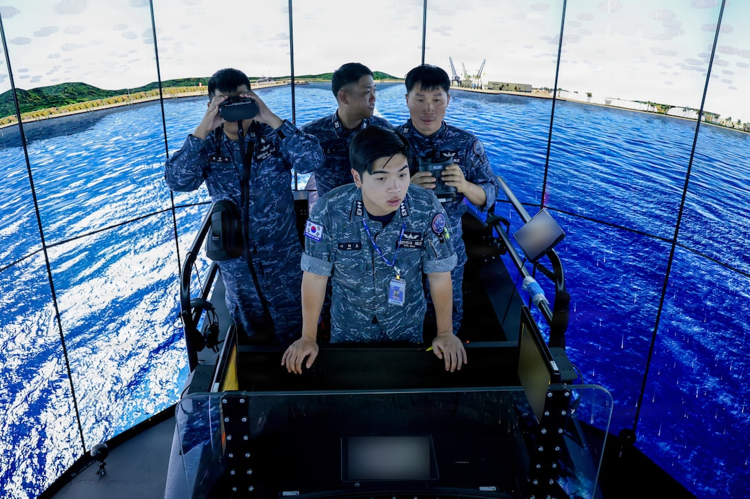 Crew members assigned to the Republic of Korea (ROK) Submarine Ahn Mu (SS 085) participate in a submarine training evolution during a visit to Naval Submarine Training Center Pacific (NSTCP) Detachment Guam, Dec. 1, 2025.