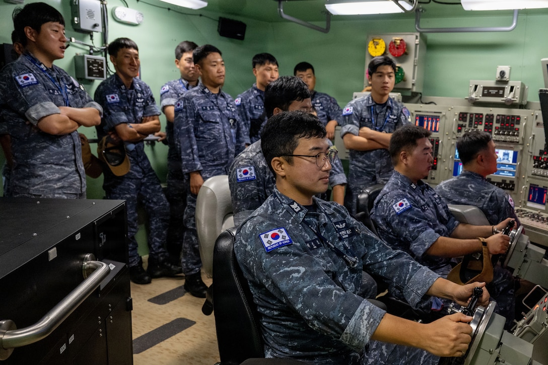 Crew members assigned to the Republic of Korea (ROK) Submarine Ahn Mu (SS 085) participate in a submarine training evolution during a visit to Naval Submarine Training Center Pacific (NSTCP) Detachment Guam, Dec. 1, 2025.