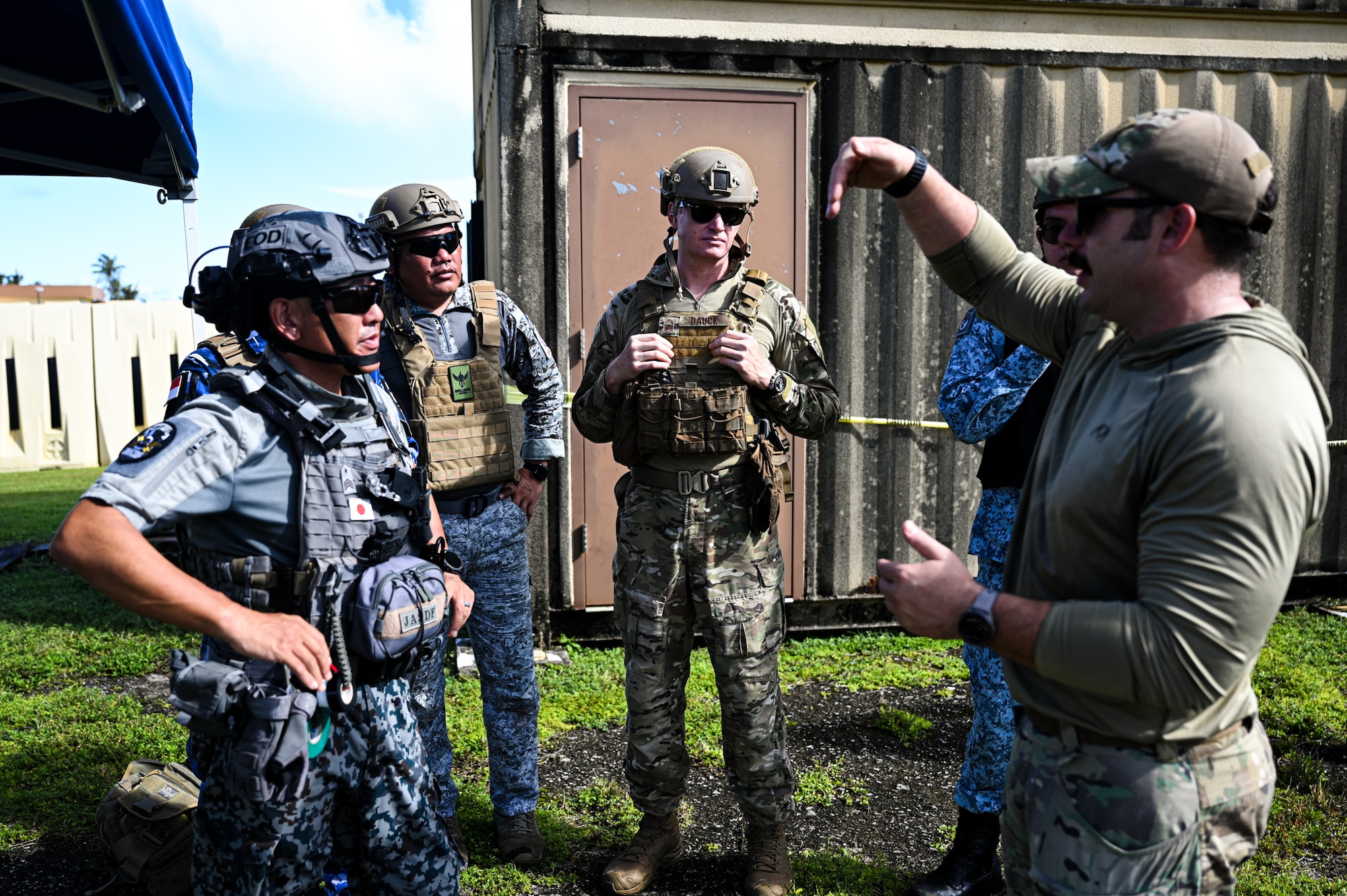 A combined team with members from the 11th Combat Air Base Squadron, other U.S. military units, Japan, Indonesia, the Philippines and Singapore establish a lever and pulley system to remove a simulated Hellfire missile from a building during exercise Silver Flag at Andersen Air Force Base, Guam, Sept. 25, 2025.