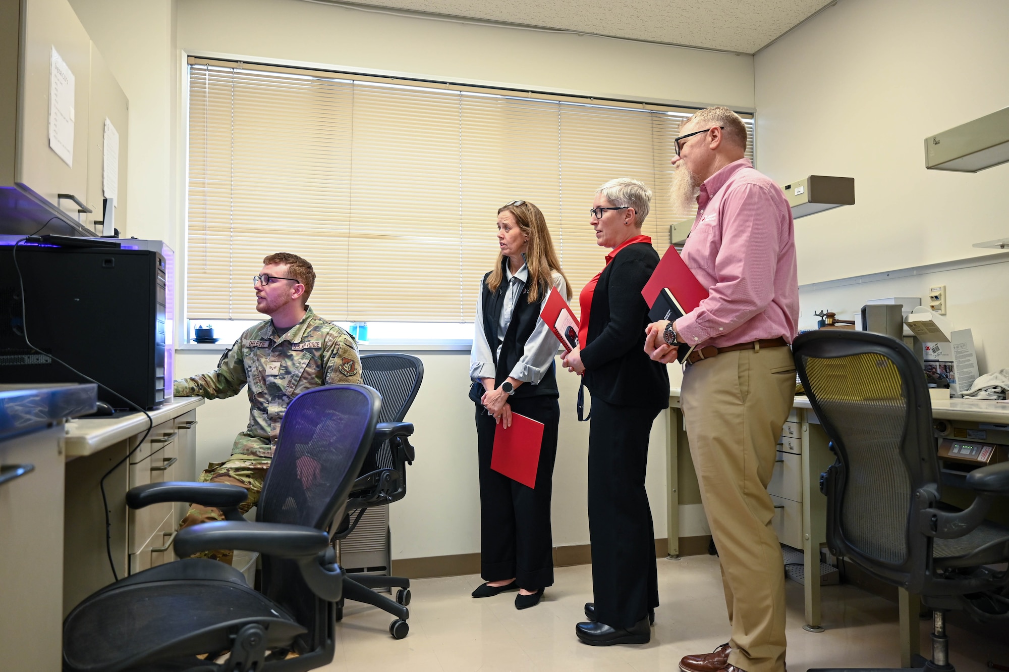 Service member shows civilian computer.