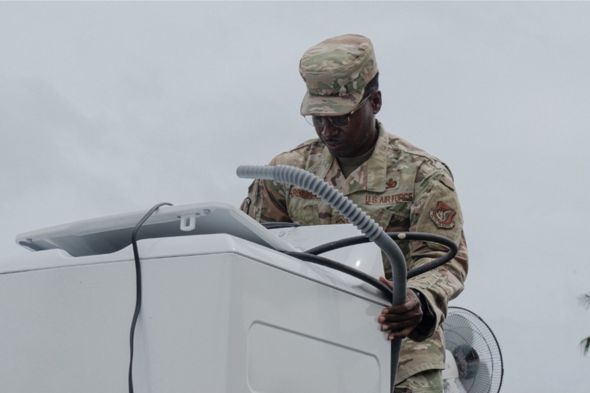 U.S. Air Force Master Sgt. Steven Miller, 11th Air Task Force first sergeant, tours a house clean-up that Airmen from the 11th ATF and 11th Combat Air Base Squadron took part in to assist displaced families at Andersen Air Force Base on Nov. 7, 2025.