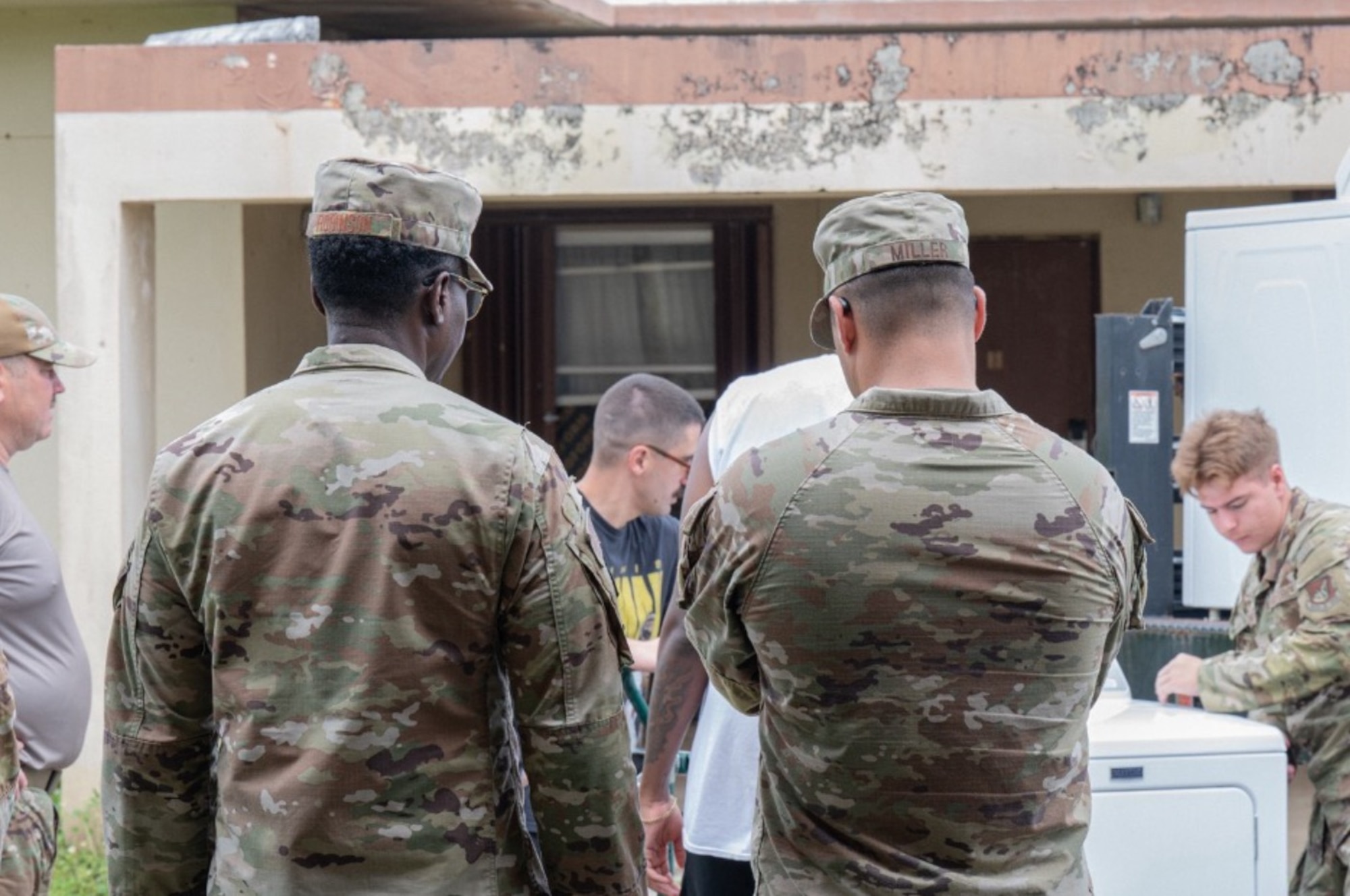 U.S. Air Force Master Sgt. Steven Miller, 11th Air Task Force first sergeant, tours a house clean-up that Airmen from the 11th ATF and 11th Combat Air Base Squadron took part in to assist displaced families at Andersen Air Force Base on Nov. 7, 2025.