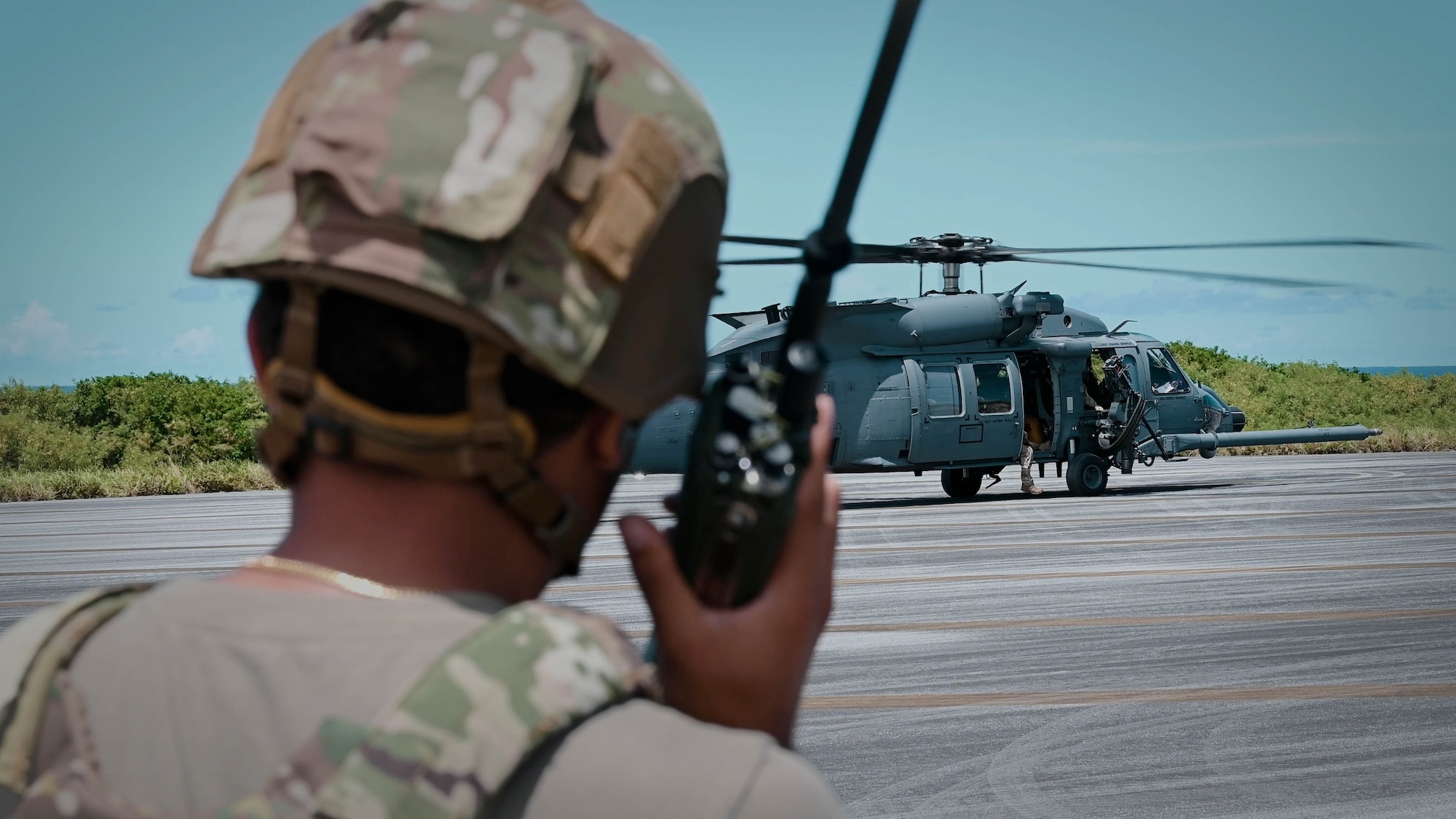 A landing zone safety officer establishes a landing zone for a HH60 Jolly Green II