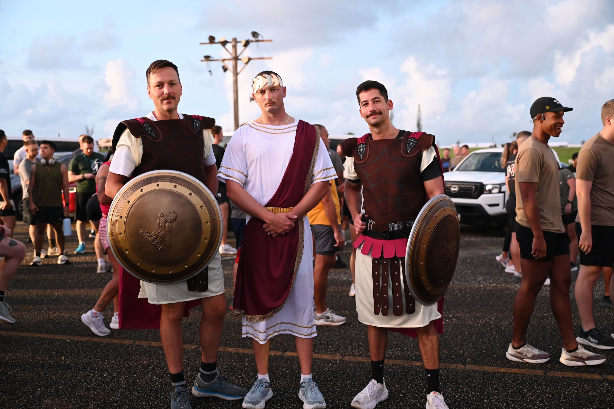 U.S. Air Force Airmen with the 11th Air Task Force pose in their heroic costumes after finishing the Zombie 5K on Halloween at Andersen Air Force Base on Oct. 31, 2025.