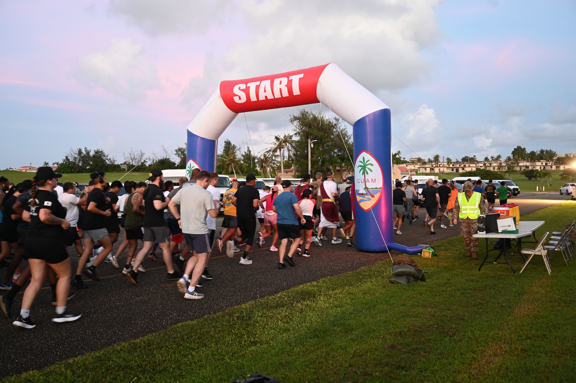 U.S. Air Force Airmen with the 11th Air Task Force pose in their heroic costumes after finishing the Zombie 5K on Halloween at Andersen Air Force Base on Oct. 31, 2025.