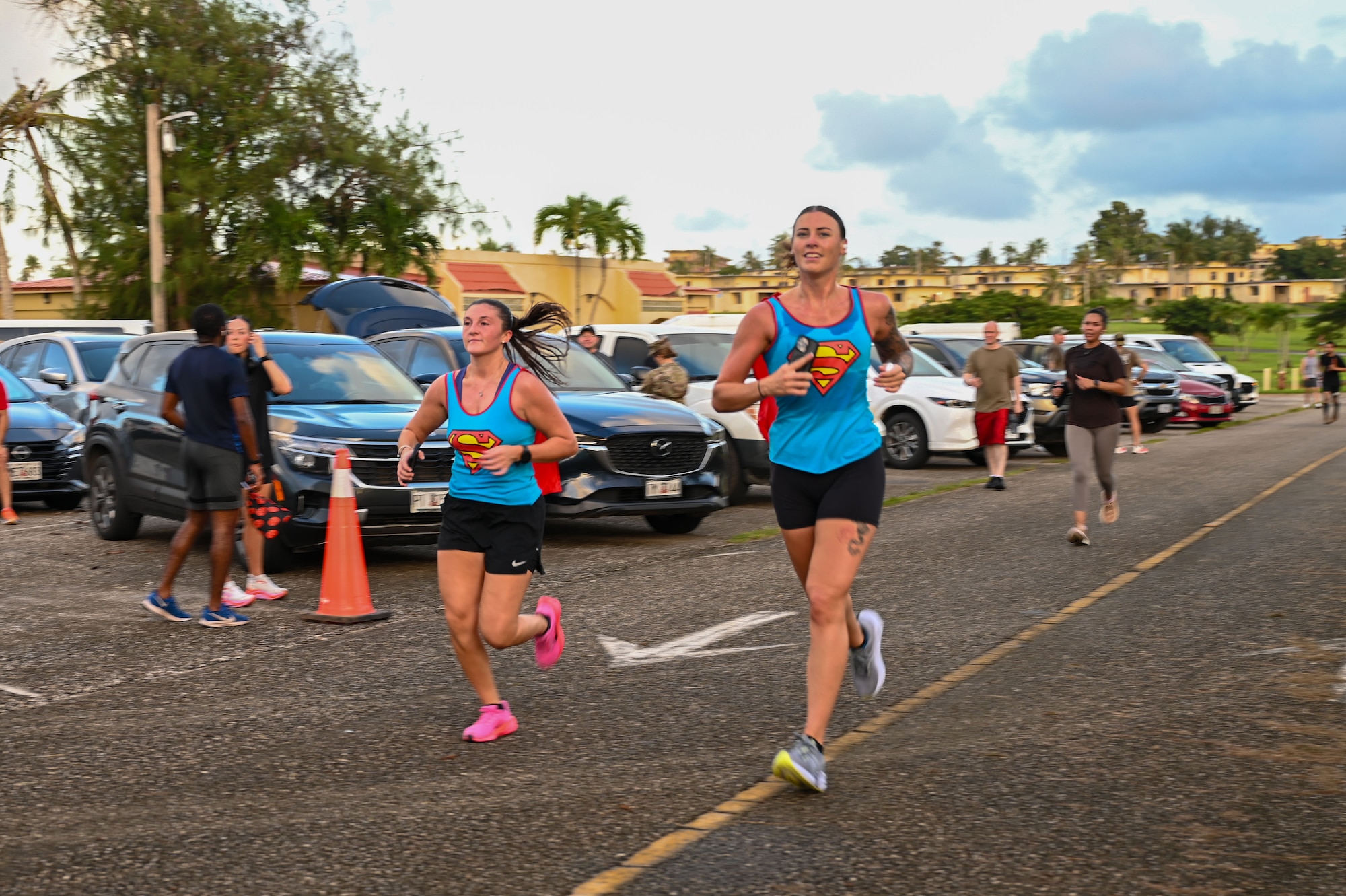 U.S. Air Force Airmen with the 11th Air Task Force pose in their heroic costumes after finishing the Zombie 5K on Halloween at Andersen Air Force Base on Oct. 31, 2025.