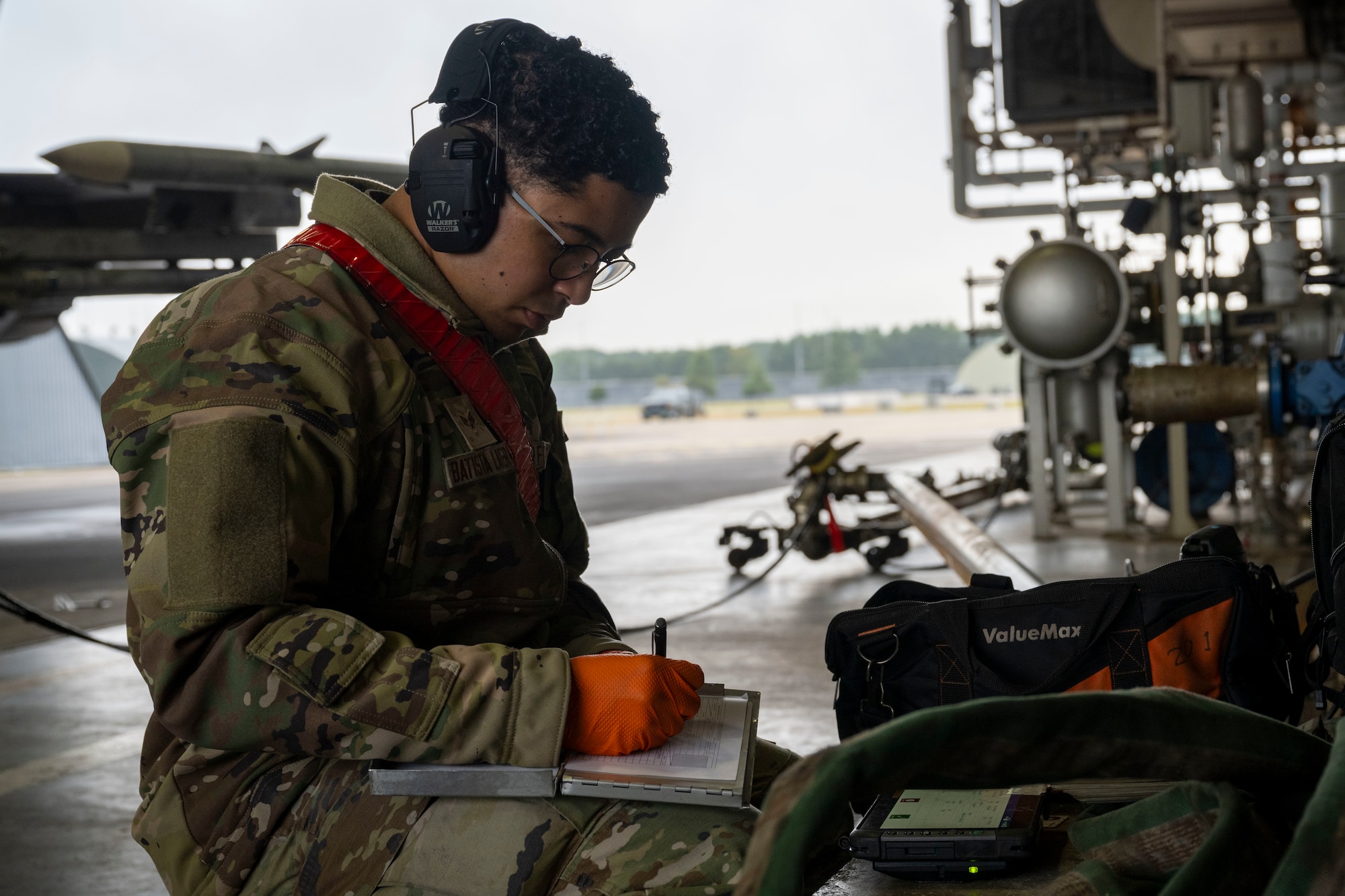 U.S. Air Force Airmen assigned to the 11th Combat Air Base Squadron, level the ground to install a concrete base at Kadena Air Base, Japan, Oct. 27, 2025.