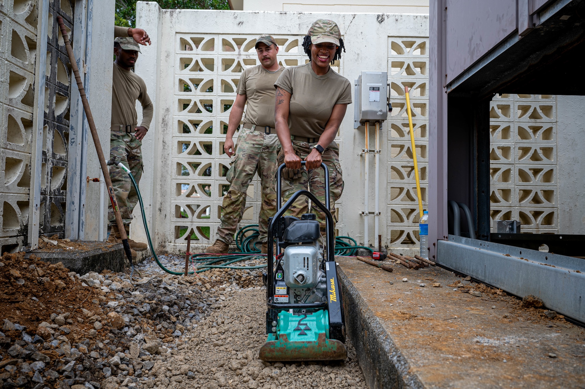 U.S. Air Force Airmen assigned to the 11th Combat Air Base Squadron, level the ground to install a concrete base at Kadena Air Base, Japan, Oct. 27, 2025.