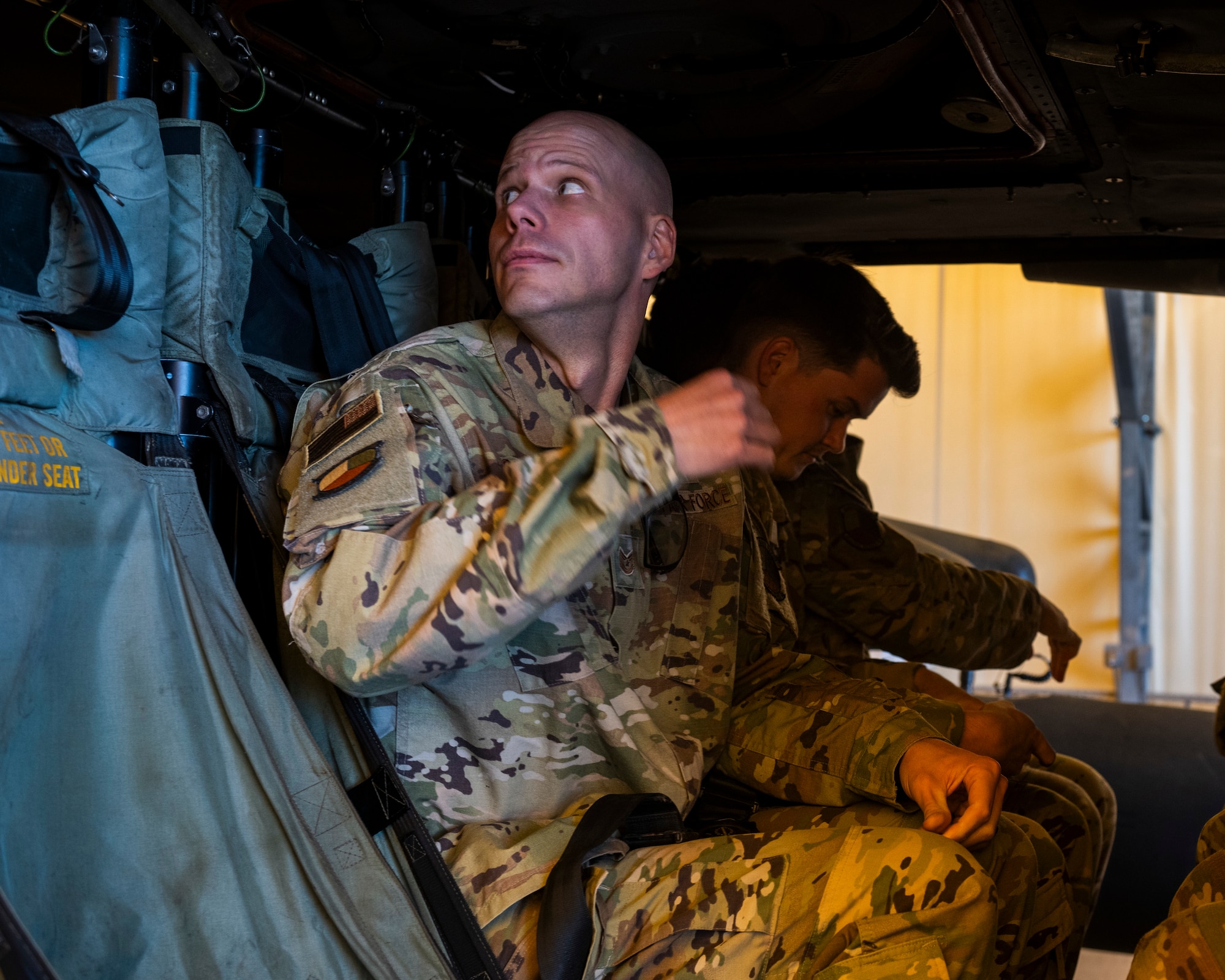A U.S. Airman secures his harness