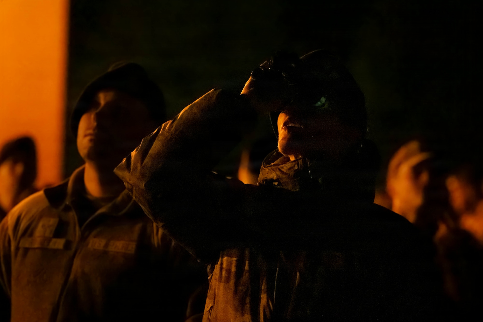 Service members observe a drone demonstration.