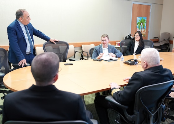 JOINT BASE SAN ANTONIO-FORT SAM HOUSTON (Dec. 8, 2025) Dr. Jeremy Pamplin, (center) program manager, Biological Technologies Office, Defense Advanced Research Projects Agency (DARPA), visited with leadership and research scientists assigned to Naval Medical Research Unit (NAMRU) San Antonio at the Battlefield Health & Trauma Research Institute. During his visit, Pamplin, a retired U.S. Army Colonel, toured laboratories where research scientists, within the Combat Casualty Care and Operational Medicine directorate, perform experiments that support the Independent Validation & Verification effort for DARPA’s Fieldable Solutions for Hemorrhage with bio-Artificial Resuscitation Products (FSHARP) program. The FSHARP program works to develop a deployable, shelf-stable, universal whole blood substitute as a hemorrhage countermeasure to sustain injured warfighters in austere, pre-hospital settings. NAMRU San Antonio, part of Navy Medicine Research & Development, works alongside research partners in the civilian sphere, academia, industry, and other government agencies to drive support of the Department of War’s objectives for a lethal fighting force and ensures U.S. service members have access to the latest scientific advances. NAMRU San Antonio conducts gap-driven combat casualty care, craniofacial, and directed energy research in support of Navy, Marine Corps and joint U.S. warfighter health readiness and lethality while engaged in routine and expeditionary operations. (U.S. Navy photo by Burrell Parmer/Released)