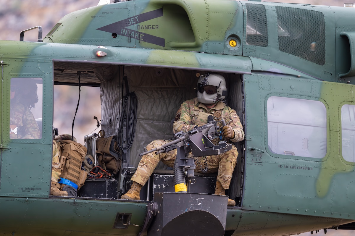 Senior Airman Luke Spradling, 40th Helicopter Squadron flight engineer, conducts aerial gunnery training in Limestone Hills, Mont., Nov. 19, 2025. The live-fire training provided hands-on experience for the aircrew in place of their simulated virtual reality weapons training. (U.S. Air Force photo by Airman 1st Class Teniya Caldwell)