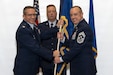 Col. Ryan D. Strong, left, 171st Air Refueling Wing commander, Pennsylvania Air National Guard, presents the 171st Air Refueling Wing guidon to Chief Master Sgt. Ryan Conley, incoming 171st ARW command chief, during an assumption of responsibility ceremony Dec. 6, 2025, near Pittsburgh, Pennsylvania. Upon assuming responsibility, Chief Conley is the 13th command chief of the unit. (U.S. Air National Guard photo by Tech. Sgt. Zoe M. Wockenfuss)