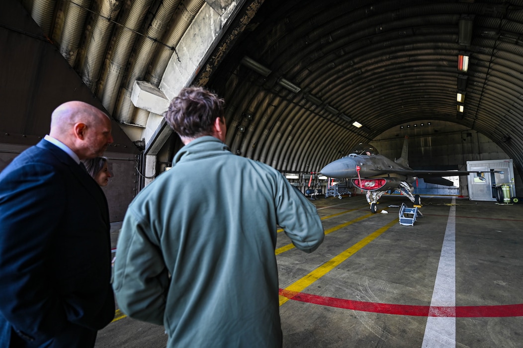 Mr. Brian Heath, consul general at the U.S. Consulate General in Frankfurt, Germany, left, speaks with U.S. Air Force Capt. Charles Jones, 480th Fighter Squadron fighter pilot, during a base tour at Spangdahlem Air Base, Germany, Oct. 27, 2025.