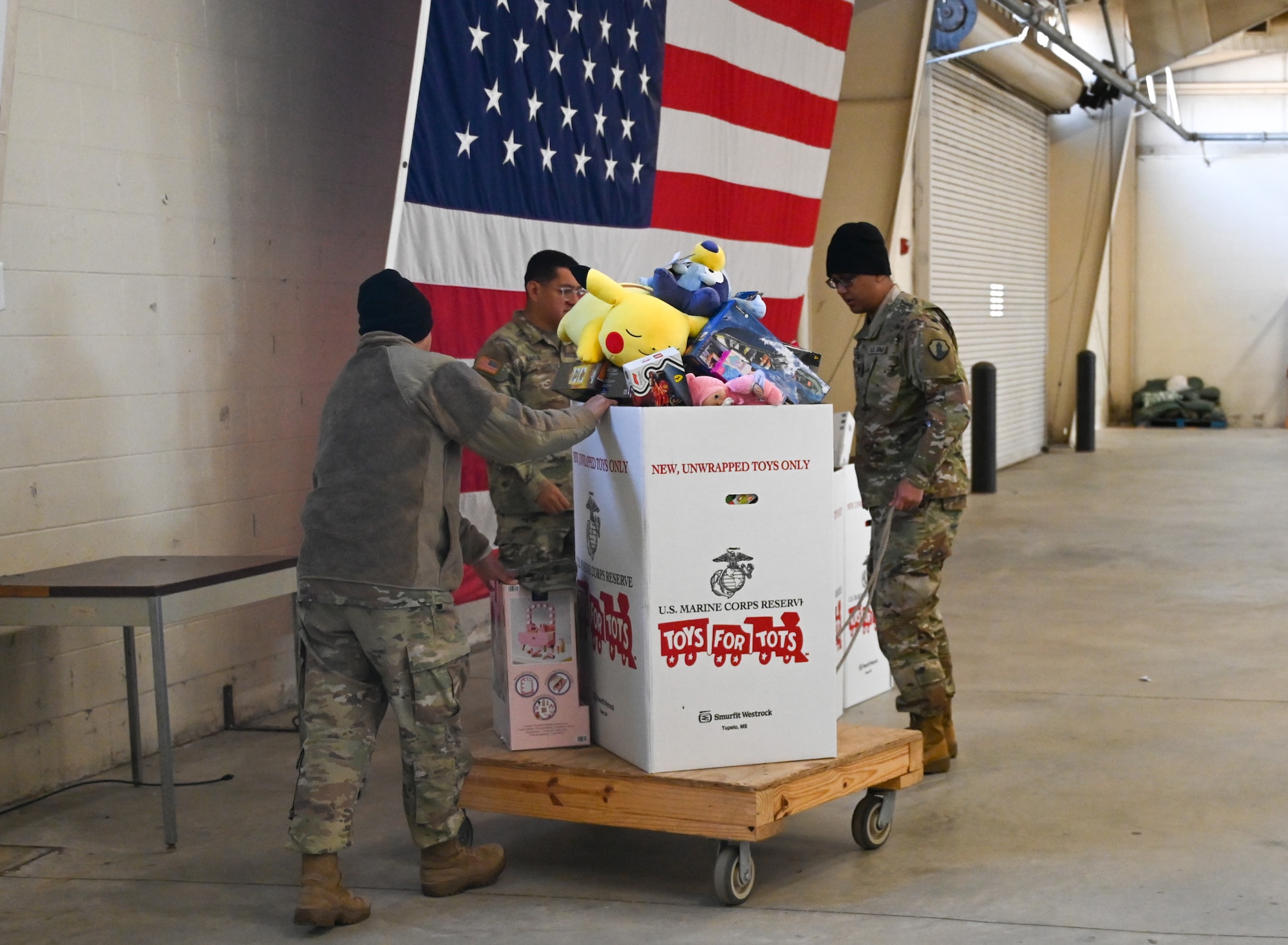 Soldiers collet donated toys