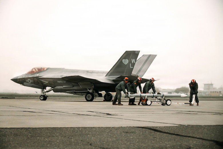 U.S. Marines with Marine Aviation Logistics Squadron 11, Marine Aircraft Group 11, 3rd Marine Aircraft Wing, load ordnance on to an F-35B Lightning II assigned to Marine Fighter Attack Squadron (VMFA) 311 during exercise Steel Knight 25 at Sacramento Mather Airport, California, Dec. 9, 2025. The forward node at Mather enabled aircraft to arm and refuel before launching a simulated Maritime Strike, demonstrating 3rd MAW’s ability to sustain fixed-wing operations from distributed locations. Steel Knight is an annual exercise that strengthens the Navy-Marine Corps team’s ability to respond forward, integrate across domains, and sustain Marine Air-Ground Task Force readiness. (U.S. Marine Corps photo by Sgt. Brian A. Stippey)