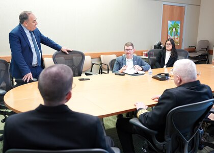 JOINT BASE SAN ANTONIO-FORT SAM HOUSTON (Dec. 8, 2025) Dr. Jeremy Pamplin, (center) program manager, Biological Technologies Office, Defense Advanced Research Projects Agency (DARPA), visited with leadership and research scientists assigned to Naval Medical Research Unit (NAMRU) San Antonio at the Battlefield Health & Trauma Research Institute. During his visit, Pamplin, a retired U.S. Army Colonel, toured laboratories where research scientists, within the Combat Casualty Care and Operational Medicine directorate, perform experiments that support the Independent Validation & Verification effort for DARPA’s Fieldable Solutions for Hemorrhage with bio-Artificial Resuscitation Products (FSHARP) program. The FSHARP program works to develop a deployable, shelf-stable, universal whole blood substitute as a hemorrhage countermeasure to sustain injured warfighters in austere, pre-hospital settings. NAMRU San Antonio, part of Navy Medicine Research & Development, works alongside research partners in the civilian sphere, academia, industry, and other government agencies to drive support of the Department of War’s objectives for a lethal fighting force and ensures U.S. service members have access to the latest scientific advances. NAMRU San Antonio conducts gap-driven combat casualty care, craniofacial, and directed energy research in support of Navy, Marine Corps and joint U.S. warfighter health readiness and lethality while engaged in routine and expeditionary operations. (U.S. Navy photo by Burrell Parmer/Released)