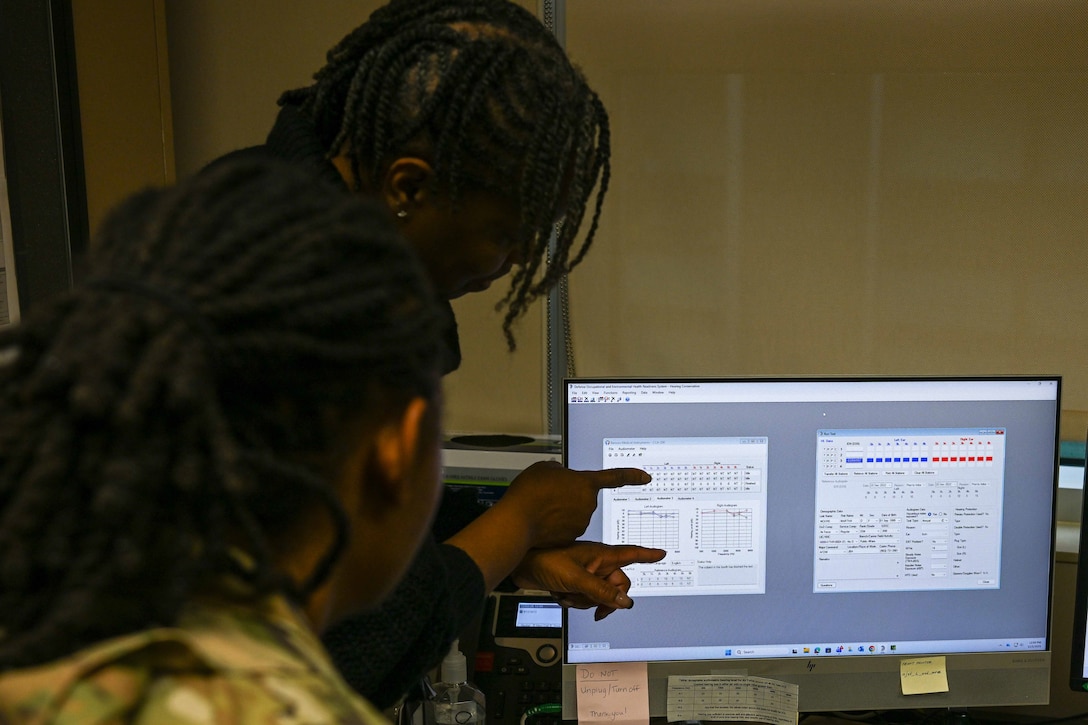 Technician explains hearing test results