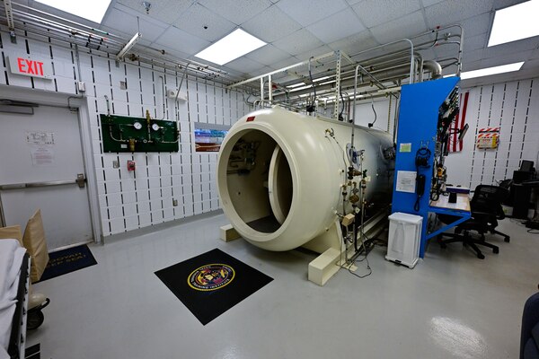 The hyperbaric chamber stands located at the Naval Aerospace Medical Institute (NAMI) stands at the ready after being awarded a Level-1 "With Distinction" accreditation from the Undersea and Hyperbaric Medical Society (UHMS), Nov. 21. With five detachments, 12 training centers, and facilities in over 60 locations across the United States, NMOTC provides high impact individual medical training for the Navy, other U.S. armed forces, and allied nations around the globe. (U.S. Navy photo by Mass Communication Specialist 1st Class Russell Lindsey SW/AW)