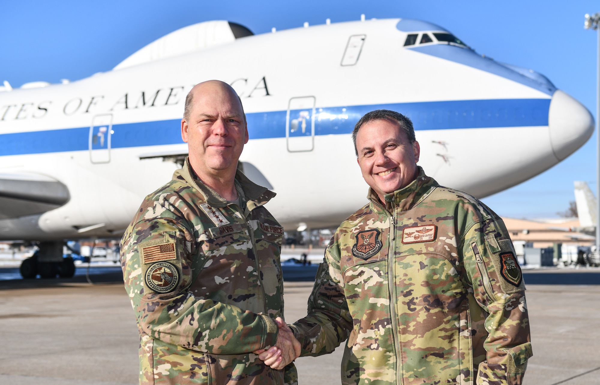 Gen. S.L. Davis, left, commander of Air Force Global Strike Command, shakes hands with Col. David Leaumont, 95th Wing commander