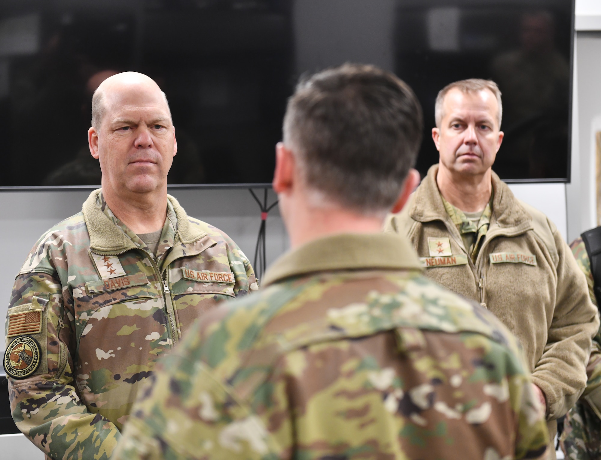 Gen. S.L. Davis, left, commander of Air Force Global Strike Command, and Maj. Gen. Ty Neuman, right, Eighth Air Force and Joint-Global Strike Operations Center commander, listen to a mission brief