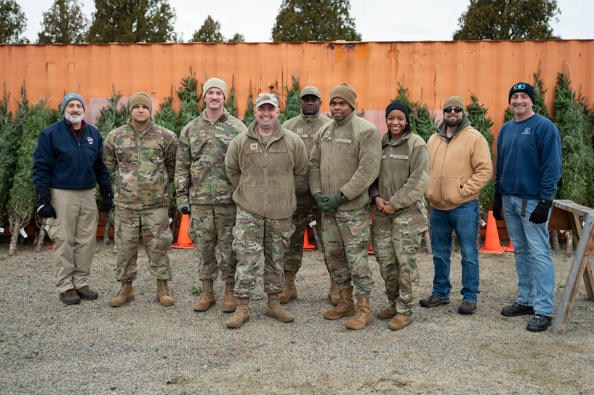 Group photo in front of trees.