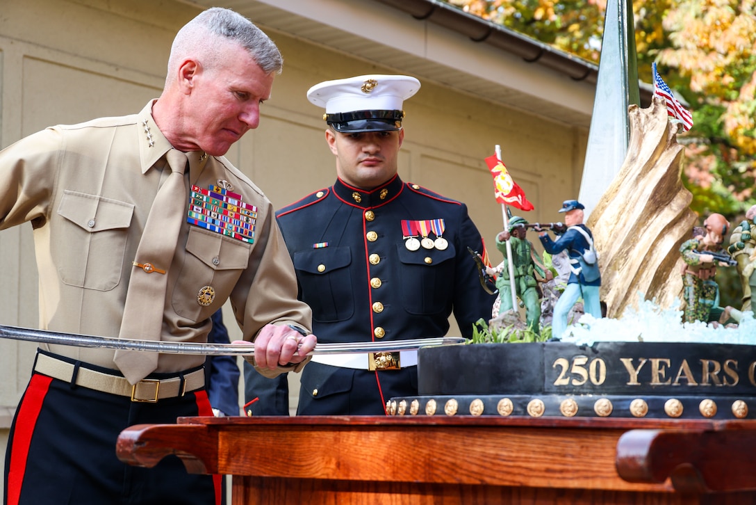 U.S. Marine Corps Gen. Eric M. Smith, 39th Commandant of the Marine Corps, cuts the ceremonial birthday cake at a Marine Corps cake cutting ceremony at the Pentagon, Nov. 5, 2025. The ceremony took place in honor of the Marine Corps 250th birthday and included the marching of the colors, cake-cutting, reciting of the birthday message, and remarks by guest speakers. (U.S. Marine Corps photo by Cpl. Christopher Prelle)