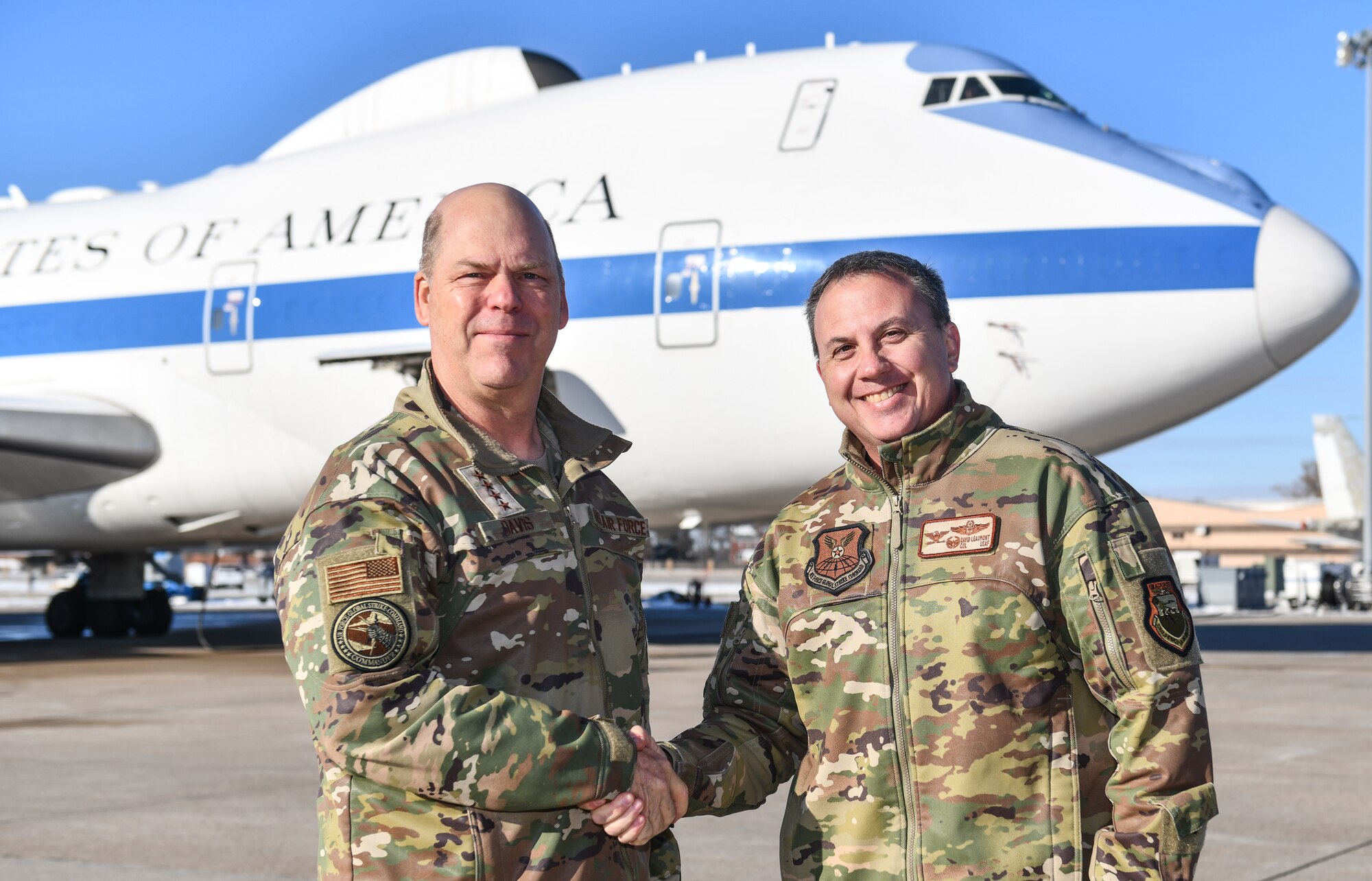 Gen. S.L. Davis, left, commander of Air Force Global Strike Command, shakes hands with Col. David Leaumont, 95th Wing commander