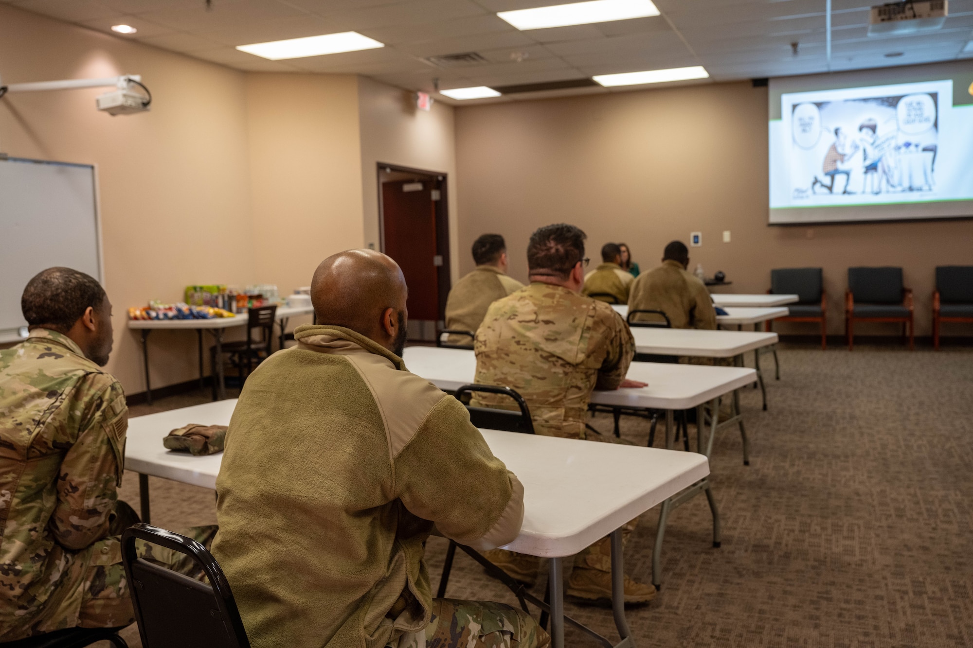 Participants of the 97th Air Mobility Wing 10 Days of Professional Development are attentive to the seminar at Altus Air Force Base, Oklahoma, Dec. 10, 2025. The program covered a wide range of topics tailored to different audiences including Airmen, non-commissioned officers, senior non-commissioned officers, company grade officers, civilians, supervisors, and flight leadership. (U.S. Air Force photo by Airman 1st Class Emma Wright)