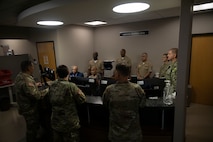 U.S. Marine Corps Brig. Gen. David Hyman, commanding general of Marine Corps Western Recruiting Region and Marine Corps Recruit Depot San Diego, receives a brief at Chicago Military Entrance Processing Station, Chicago, Illinois, 17 Sept. 2025. General Hyman visited Chicago MEPS during a routine visit to Marine Corps Recruiting Station Chicago, during which he awarded several employees and service members with a challenge coin for a job well done. (U.S. Marine Corps photo by Sgt. Dalton J. Payne)